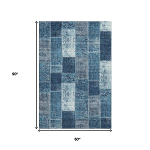 HomeRoots 5' Blue and Ivory Patchwork Area Rug - Washable, UV-Protected, Stain-Resistant with Non-Slip Backing 652931