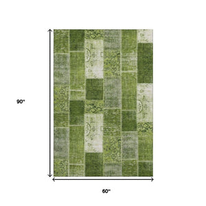 HomeRoots 5' X 8' Olive Green & Ivory Patchwork Rug - Durable, Washable, UV-Protected for High-Traffic Spaces 652937