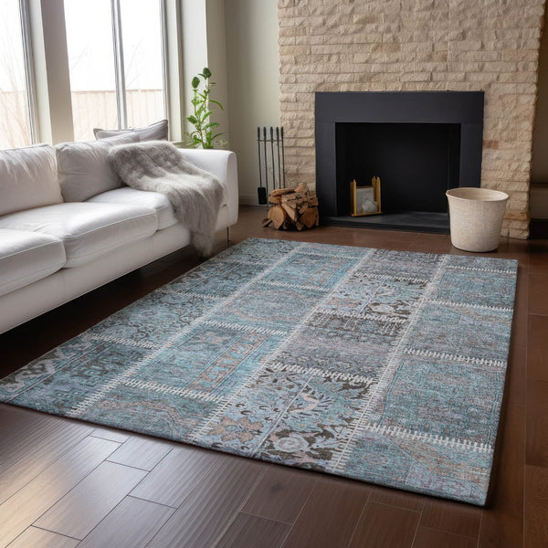 HomeRoots 10' Teal and Beige Patchwork Area Rug - Washable, UV-Protected, Durable for High-Traffic Spaces 653260