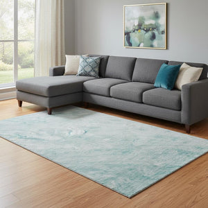 HomeRoots 8' X 10' Teal And Ivory Abstract Washable Area Rug - Durable, Stylish, UV-Protected for Modern Spaces 653468