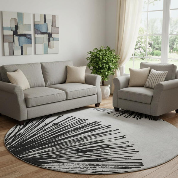 HomeRoots 8' Black And Ivory Abstract Round Rug - Washable, UV Protected, Stain Resistant for Modern Homes 653527