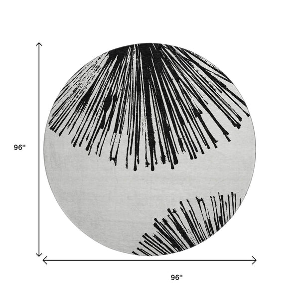 HomeRoots 8' Black And Ivory Abstract Round Rug - Washable, UV Protected, Stain Resistant for Modern Homes 653527