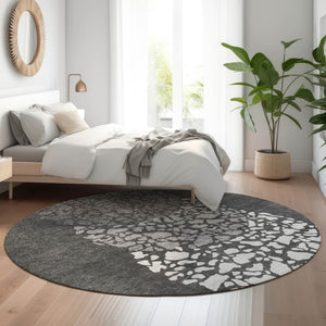 HomeRoots 8' Charcoal and Ivory Abstract Round Rug - Washable, UV Protected, Family-Friendly & Stylish Design 653569