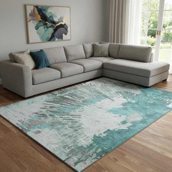 HomeRoots 10' X 14' Teal, Ivory & Gray Abstract Area Rug – Washable, UV-Protected, Family-Friendly Design 653644