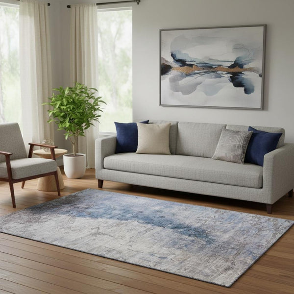 HomeRoots 5' X 8' Blue Ivory and Gray Abstract Area Rug - Stylish, Washable, UV-Protected for All Spaces! 653652