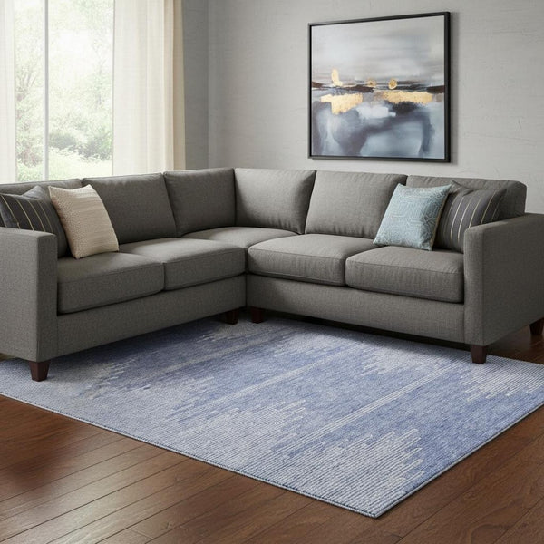 HomeRoots 9' X 12' Durable Denim Blue & Ivory Abstract Area Rug with UV Protection for High-Traffic Spaces 653688