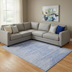 HomeRoots 10' X 14' Denim Blue & Ivory Abstract Washable Area Rug with UV Protection for Modern Spaces 653689