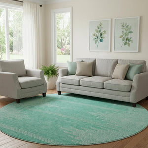 HomeRoots 8' Teal and Ivory Abstract Round Rug - Washable, UV Protected, Ideal for Busy Homes & Modern Spaces 653722