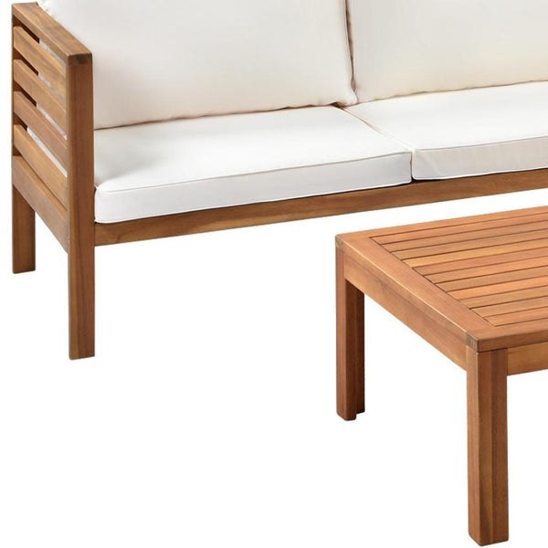 HomeRoots Four-Piece Solid Wood Sectional Seating Group with Cushions & Coffee Table - Perfect for Outdoor Relaxation! 653926