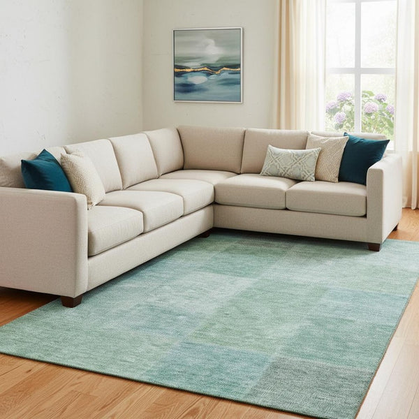 HomeRoots 10' X 14' Stylish Teal and Ivory Washable Area Rug with UV Protection - Perfect for Family Spaces! 655240