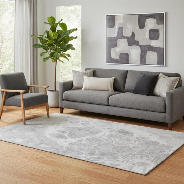 HomeRoots 5' X 8' Gray and Ivory Abstract Area Rug - Washable, UV Protected, Durable for Pets & Kids' Spaces 656036