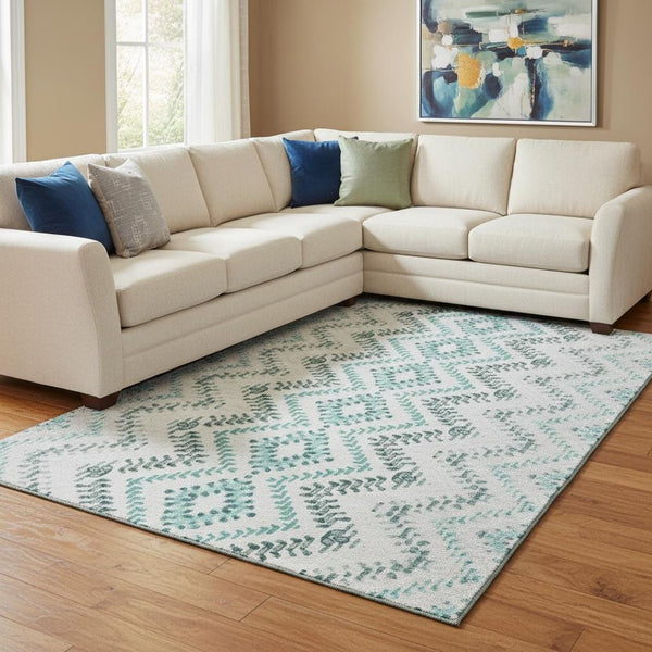 HomeRoots 9' X 12' Teal and Ivory Geometric Area Rug - Washable, UV Protected, Perfect for High-Traffic Spaces 656117