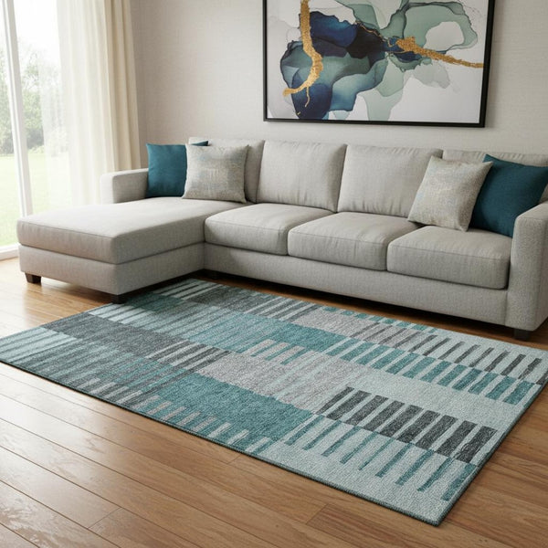 HomeRoots 9' X 12' Striped Teal Ivory Gray Washable Area Rug with UV Protection for Indoor-Outdoor Spaces 656273