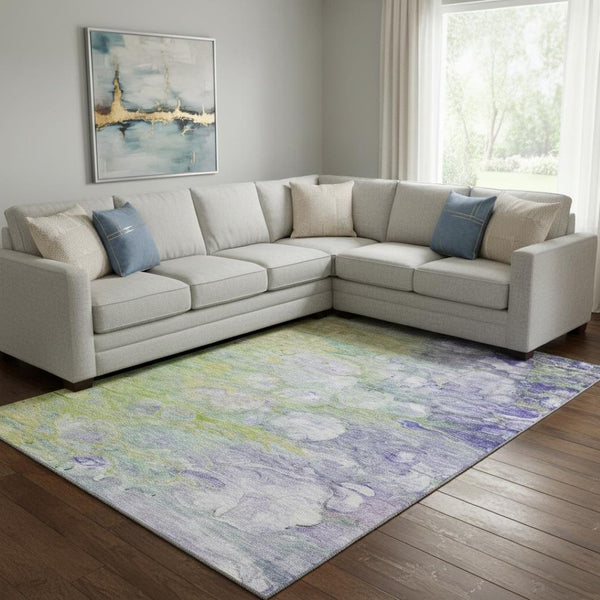 HomeRoots 8' X 10' Abstract Area Rug in Artichoke Green, Purple & Ivory - Washable, UV Protected, Durable Design 656697