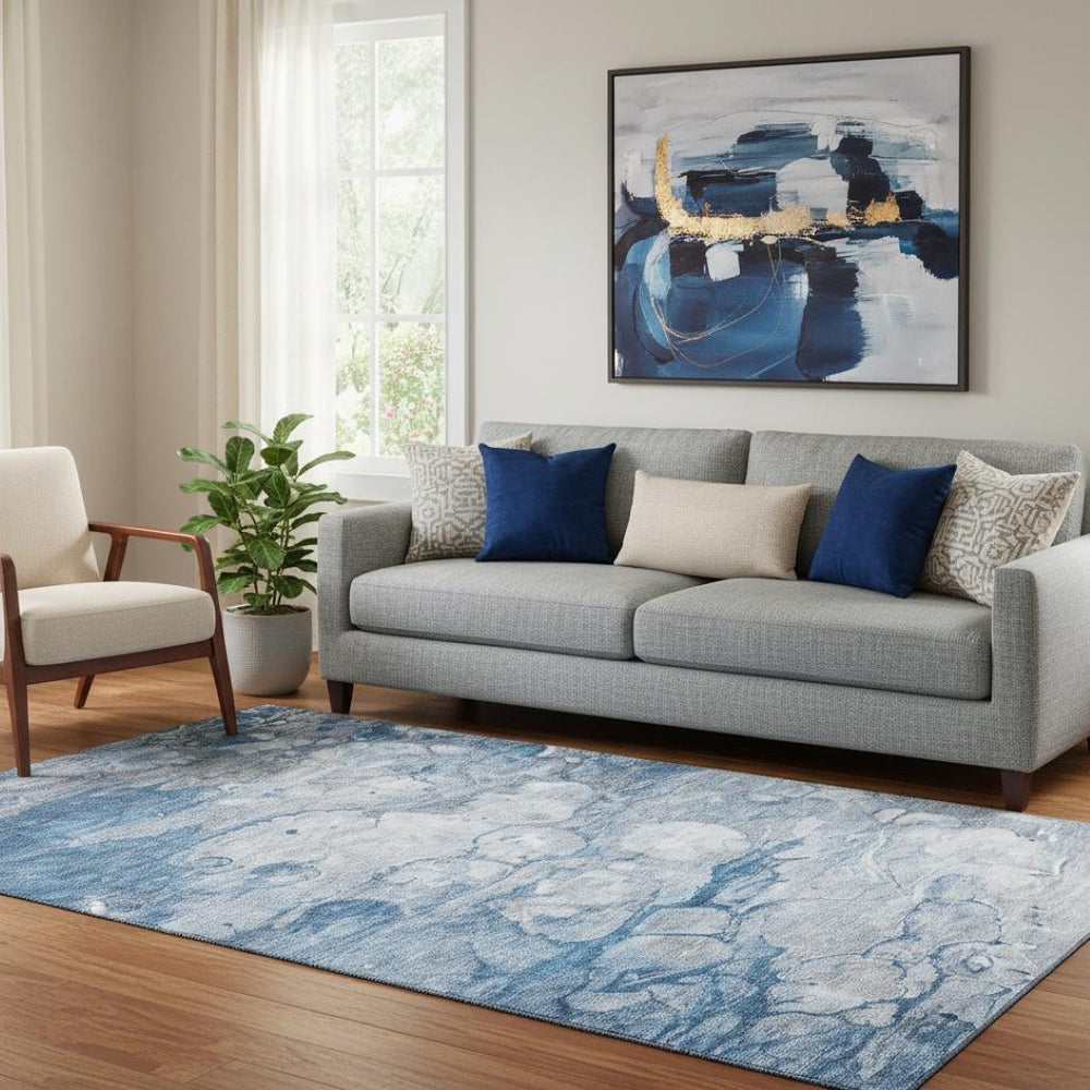 HomeRoots 5' X 8' Blue and Ivory Abstract Area Rug - Washable, Durable, UV Protected for Modern Spaces 656707