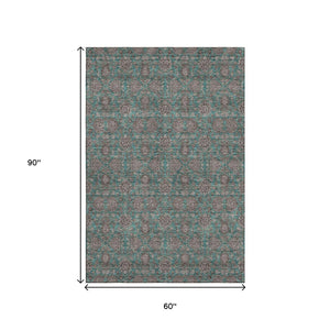 HomeRoots 5' X 8' Teal & Beige Floral Area Rug - Washable, UV-Protected, Stain Resistant for High-Traffic Spaces 656857