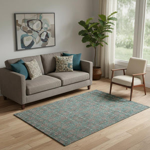 HomeRoots 5' X 8' Teal & Beige Floral Area Rug - Washable, UV-Protected, Stain Resistant for High-Traffic Spaces 656857