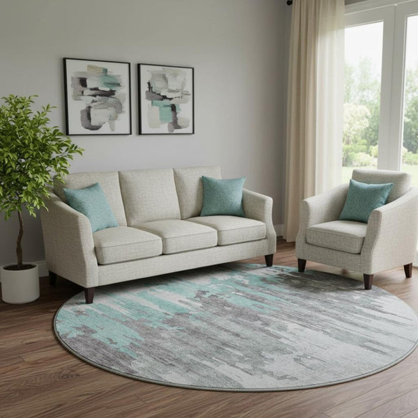 HomeRoots 8' Teal Gray and Ivory Abstract Washable Round Rug - Durable, UV-Protected, Stylish Home Décor Choice 656960