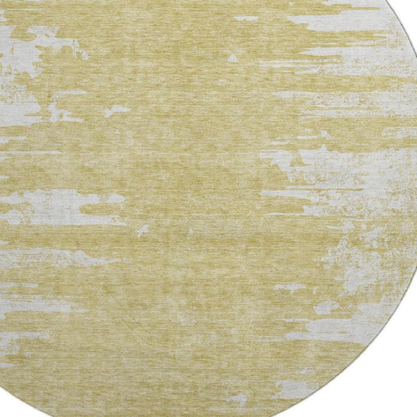 HomeRoots 8' Gold and Ivory Abstract Round Rug - Washable, UV-Protected, Stylish Solution for High-Traffic Areas 656972