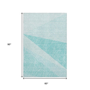 HomeRoots 5' X 8' Teal and Ivory Geometric Area Rug - Washable, UV-Protected, Stylish for Any Space! 657043