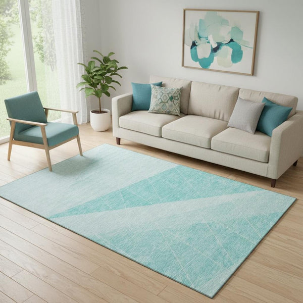 HomeRoots 5' X 8' Teal and Ivory Geometric Area Rug - Washable, UV-Protected, Stylish for Any Space! 657043