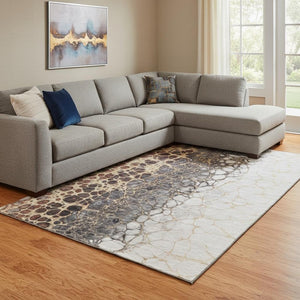 HomeRoots 10' Contemporary Ivory Gray & Gold Abstract Area Rug – Washable, UV Protected, Durable Design 657077
