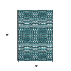 HomeRoots 5' X 8' Teal And Ivory Tribal Area Rug - Stain-Resistant, UV Protected, Non-Slip for Busy Homes 657139