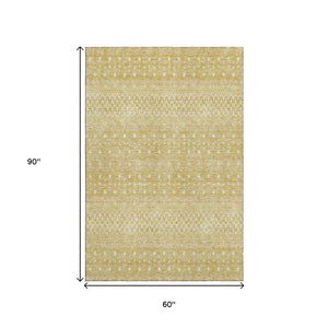 HomeRoots 5' X 8' Gold and Ivory Tribal Area Rug – Washable, UV-Protected, Perfect for High-Traffic Spaces! 657169