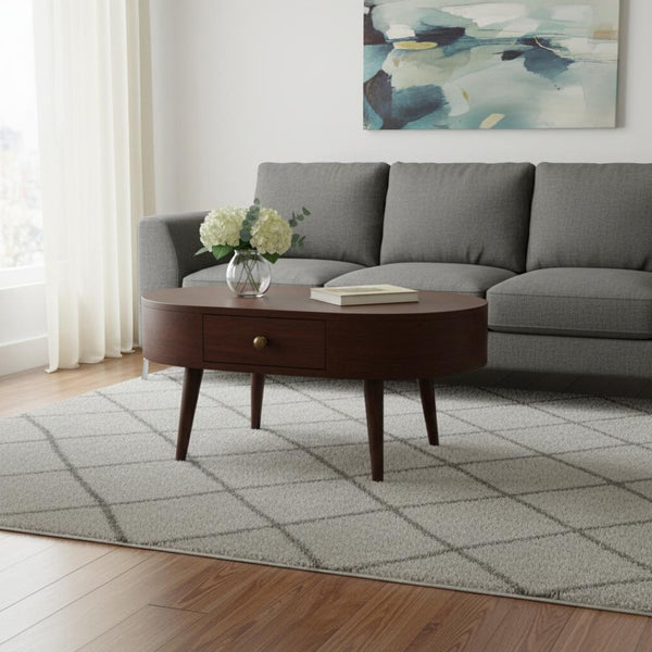 HomeRoots 34" Walnut Solid Wood Oval Coffee Table with Drawer - Timeless Design for Modern Living Spaces 657370