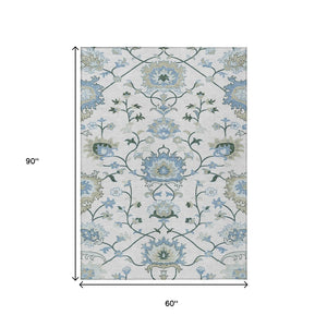 HomeRoots 5' X 8' Washable Floral Area Rug in Ivory, Blue & Beige - Perfect for Indoor & Outdoor Spaces! 657962