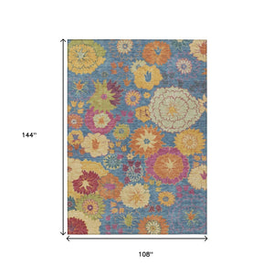 HomeRoots 9' Floral Area Rug in Blue, Gold & Pink - Washable, Heavy-Duty Indoor/Outdoor Design for Versatile Use 658055