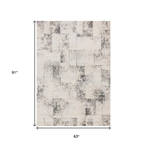 HomeRoots 5' Cream and Black Abstract Area Rug - Modern Artistry Meets Durability for Stylish Living Spaces 5' X 8' 660027