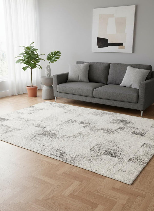 HomeRoots 5' Cream and Black Abstract Area Rug - Modern Artistry Meets Durability for Stylish Living Spaces 5' X 8' 660027