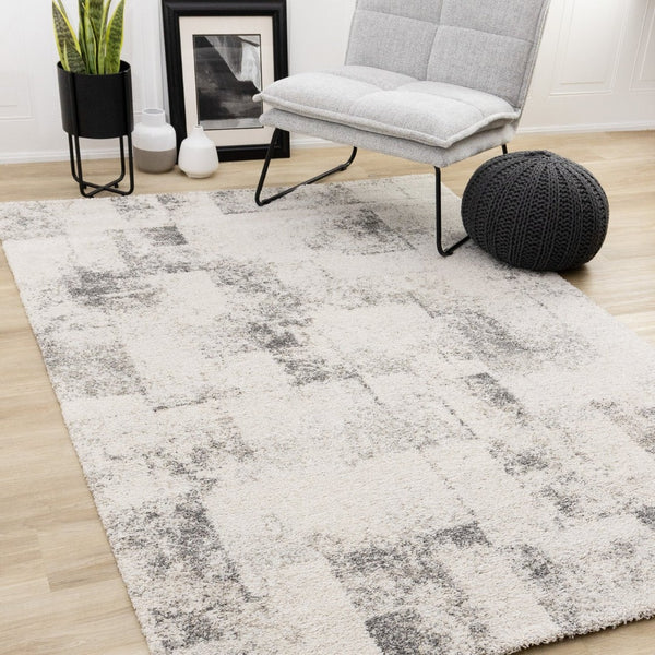 HomeRoots 5' Cream and Black Abstract Area Rug - Modern Artistry Meets Durability for Stylish Living Spaces 5' X 8' 660027
