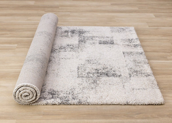 HomeRoots 5' Cream and Black Abstract Area Rug - Modern Artistry Meets Durability for Stylish Living Spaces 5' X 8' 660027
