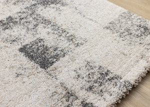 HomeRoots 5' Cream and Black Abstract Area Rug - Modern Artistry Meets Durability for Stylish Living Spaces 8' X 11' 660028