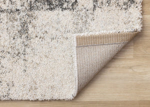 HomeRoots 5' Cream and Black Abstract Area Rug - Modern Artistry Meets Durability for Stylish Living Spaces 8' X 11' 660028