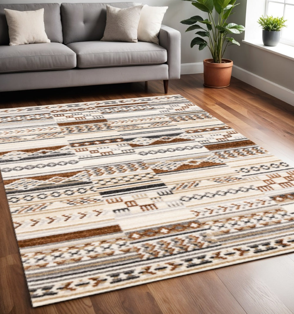 HomeRoots 5' Tribal Area Rug in Cream, Black, and Brown - Durable, Stain-Resistant Carpet for Modern Spaces 5' X 8' 660255