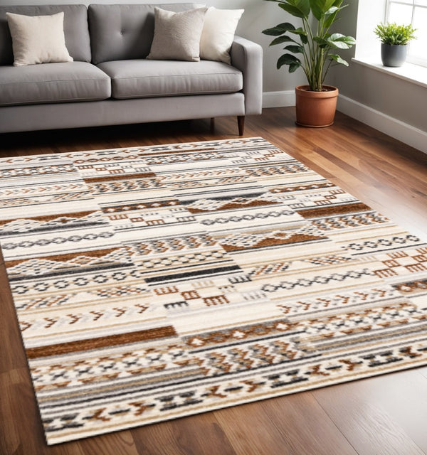 HomeRoots 5' Tribal Area Rug in Cream, Black, and Brown - Durable, Stain-Resistant Carpet for Modern Spaces 5' X 8' 660255