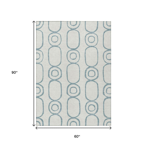 HomeRoots 5' Teal Blue & Ivory Geometric Area Rug - Washable Indoor/Outdoor Rug for Stylish Living Spaces 660644