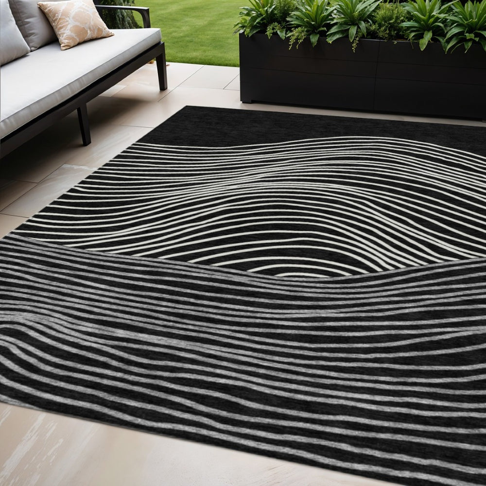 HomeRoots 5' X 8' Stylish Black, Ivory, and Gray Striped Washable Area Rug for Indoor & Outdoor Spaces 660944