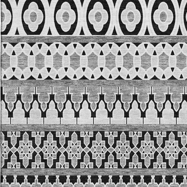 HomeRoots 9' X 12' Black And Ivory Ikat Area Rug - Stylish, Washable, UV-Protected for High-Traffic Spaces 661424