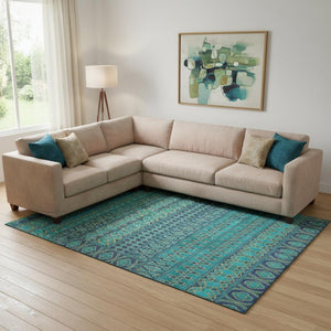HomeRoots 9' X 12' Teal and Gold Ikat Area Rug – Washable, Stain Resistant, UV Protected for Modern Spaces 661484