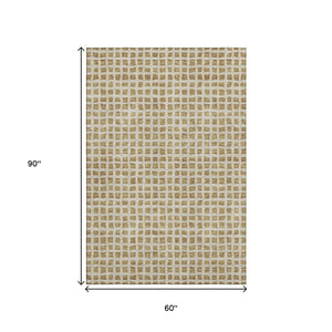 HomeRoots 5' X 8' Gold and Ivory Geometric Area Rug – Washable, UV Protected, Stylish for Homes with Kids & Pets 661505