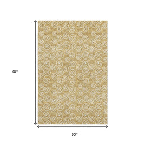 HomeRoots 5' X 8' Gold and Ivory Polka Dot Washable Area Rug – UV Protected, Stylish & Kid-Friendly Design! 661565