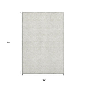 HomeRoots 5' X 8' Ivory and Beige Polka Dot Area Rug - Stain-Resistant, UV Protected, Perfect for Busy Homes 661583