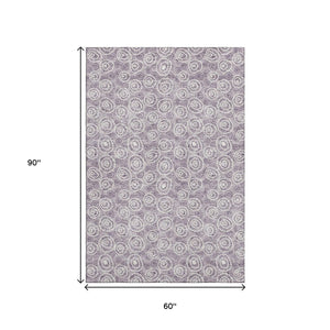 HomeRoots 5' X 8' Polka Dot Area Rug in Lavender & Ivory - Washable, UV Protected, Durable, Kid & Pet Friendly! 661589