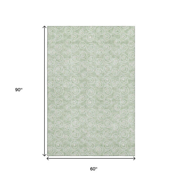 HomeRoots 5' X 8' Mint Green & Ivory Polka Dot Washable Area Rug - Durable, UV-Protected, Kid & Pet Friendly! 661595