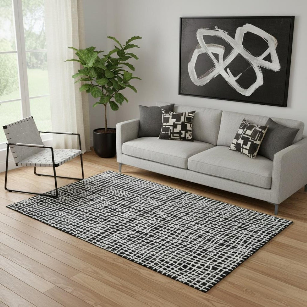 HomeRoots 5' X 8' Striped Black And Ivory Washable Area Rug - Durable, UV Protection, Perfect for Active Homes 661625