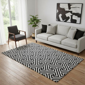 HomeRoots 5' X 8' Black And Ivory Geometric Area Rug - Durable, Washable, UV-Protected for High-Traffic Spaces 661781